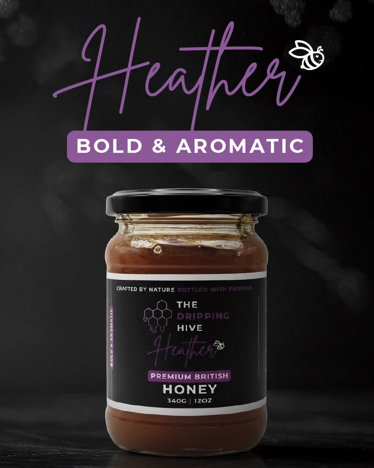 A jar of Wild Heather honey on slate with a sprig of heather